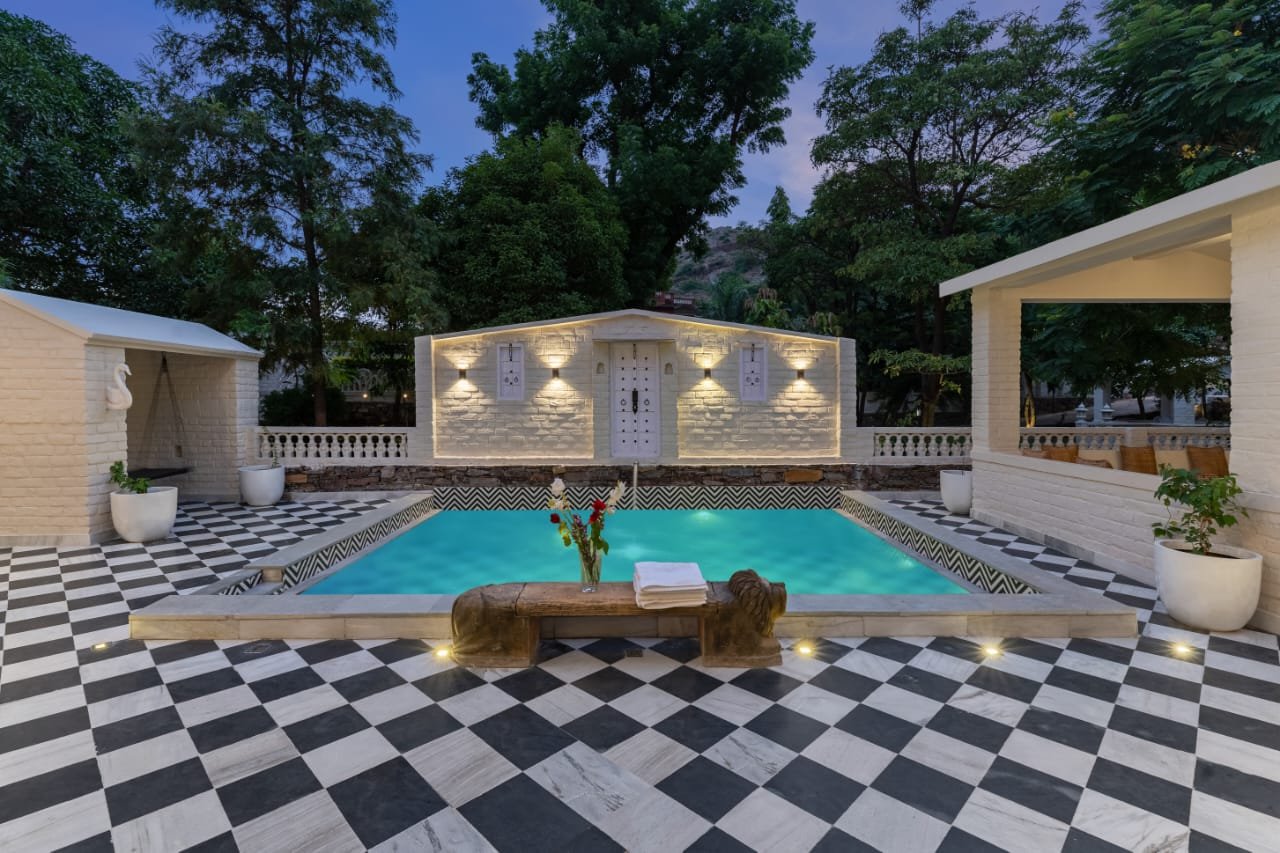 Sunken poolside lounge and private swimming pool at Shourya Bliss Villa