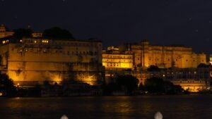 Best places in Udaipur to celebrate Diwali and Dussehra: Illuminated City Palace at night across Lake Pichola